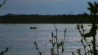 Fishermen in canoes at the opening of the Moisie river