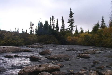 at the foot of the rapids