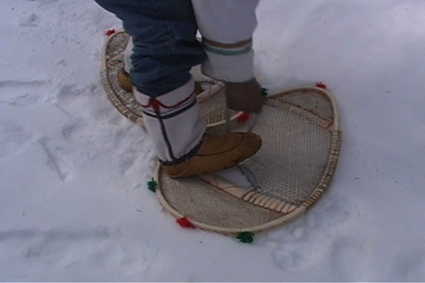he puts on his snowshoes