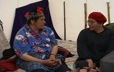 Inside a tent, an elder from Natashquan talks with Evelyne St-Onge