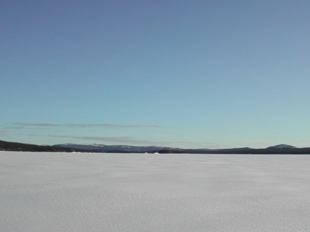 Frozen lake with islands in the distance