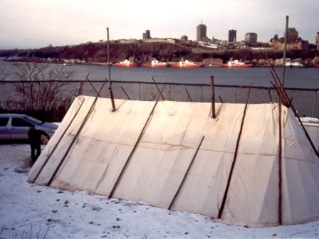 View of a shaputuan with the city of Quebec in the background