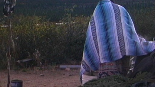 A woman comes out of the sweat lodge