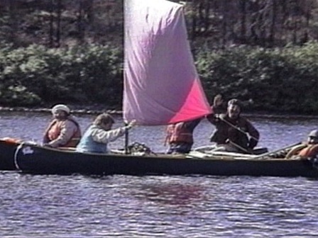 Groups of Innu in canoes with sails