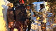 A group of Innus welcomes a visitor