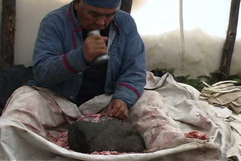 he crushes the bones with a  mortar and pestle