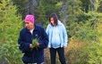 Evelyne St-Onge and her granddaughter, Laura Pinette, take a walk in the bush