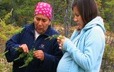 In the bush, Evelyne St-Onge explains the properties of a medicinal plant to Laura Pinette