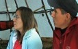 Young couple listening attentively to a grandmother’s teachings