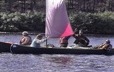 Groups of Innu in canoes with sails