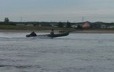 Motorized canoe in front of the community of Ekuanitshit