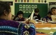 Innu children perform manual tasks in a school in Unaman-shipu