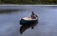 Launching of a traditional canoe on a lake