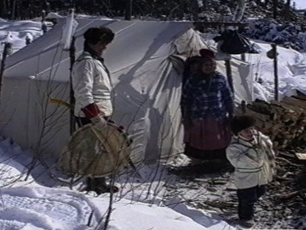 Messenak Bellefleur receives his first snowshoes from his great-grandmother