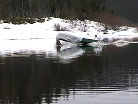 Rowboat, carefully camouflaged for duck-hunting